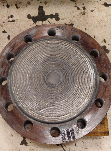 Flange face after weld overlay, showing the deposited surface